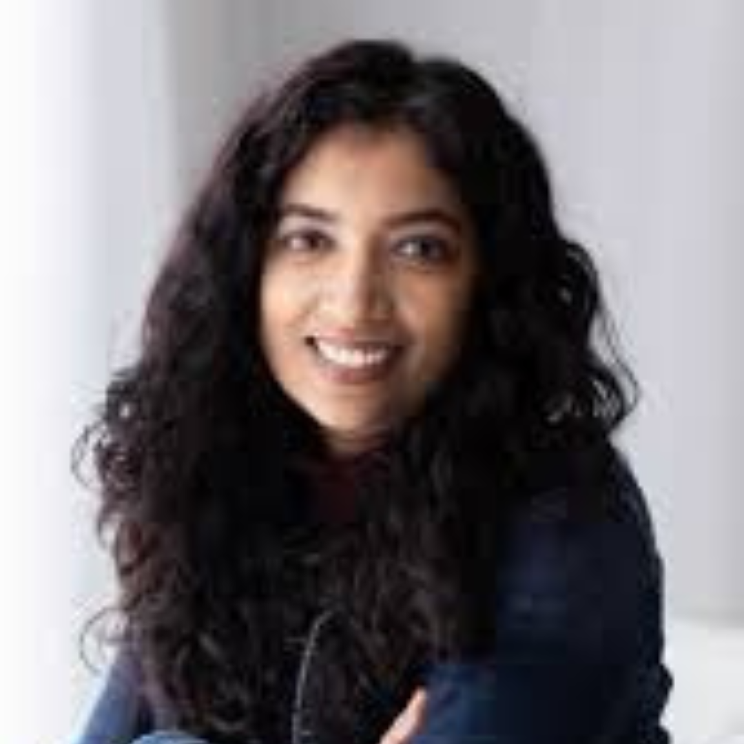 A photo of Vaish, a south asian woman with long dark curly hair
